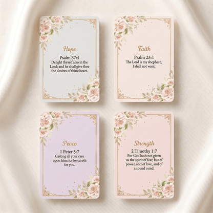 Four decorative cards arranged in a 2x2 grid on a soft white fabric background. The cards feature floral corner designs and gold borders, with the words Hope, Faith, Peace, and Strength at the top, and Bible verse text below.