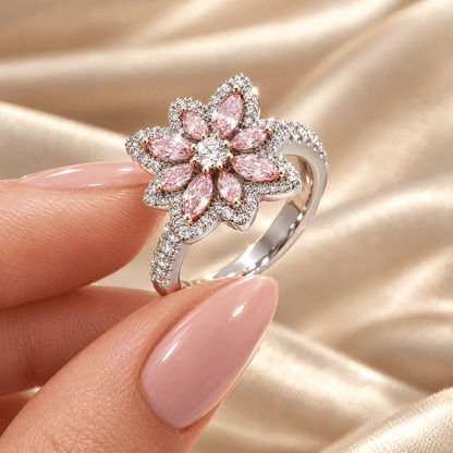 Pink Zircon Flower Ring - Deborah held between fingers