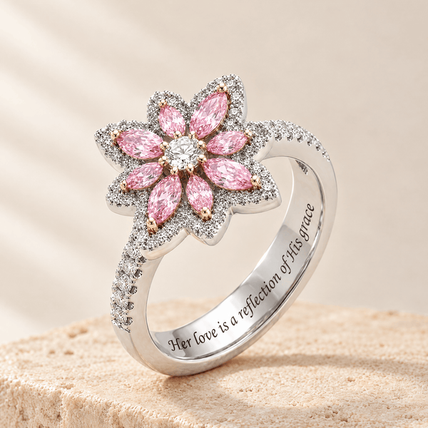 Pink Zircon Flower Ring - Deborah on a travertine stone