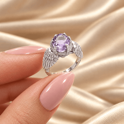 Oval Violet Zircon Ring - Anna held between fingers