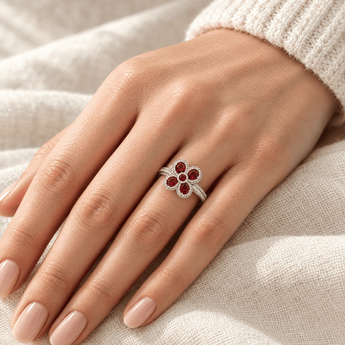 Red Zircon Petal Cross Ring - Sarah on hand