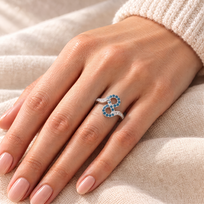 Blue Zircon Infinity Ring - Leah on hand