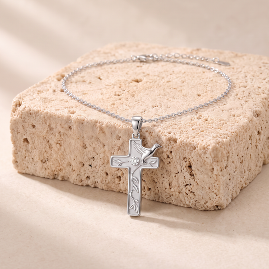 Ruth dove cross necklace on travertine