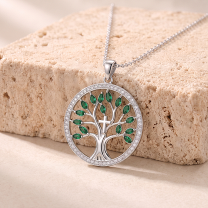Naomi green zircon tree of life necklace on travertine
