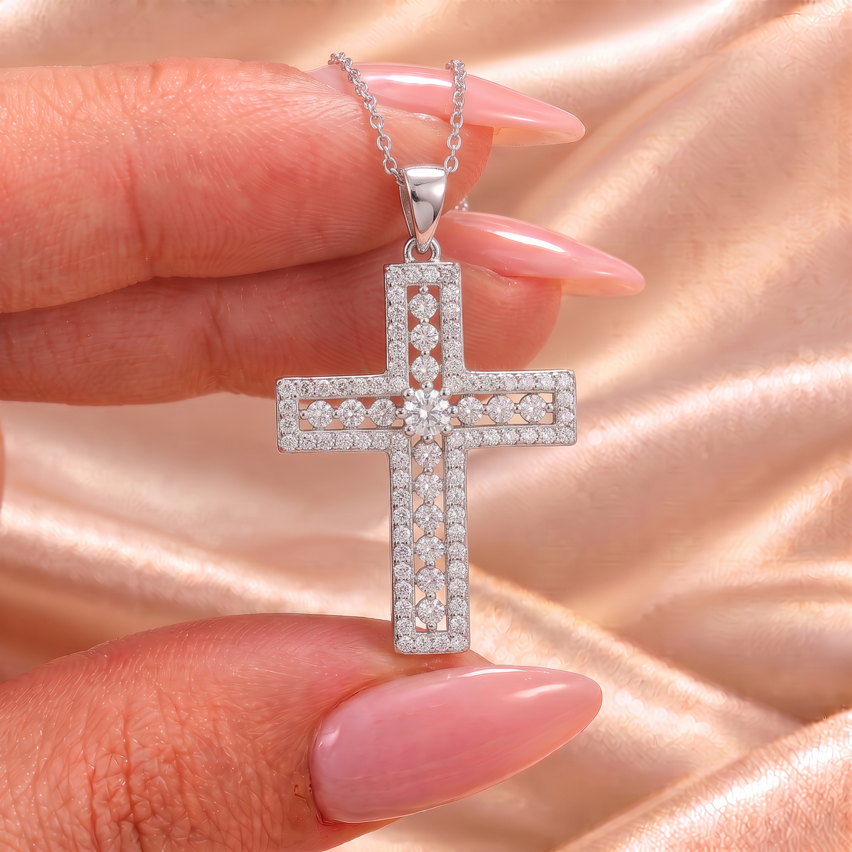 Phoebe moissanite cross pendant held on satin