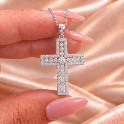 Phoebe moissanite cross pendant held on satin