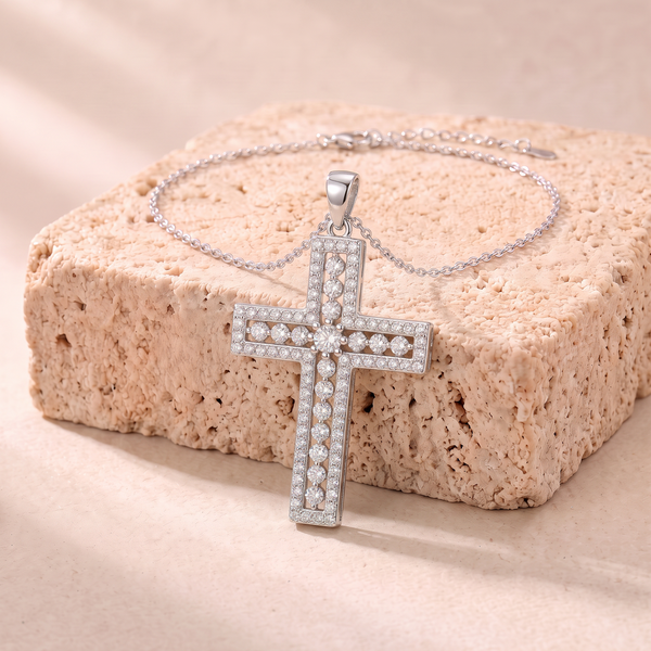 Phoebe moissanite pave cross necklace on travertine