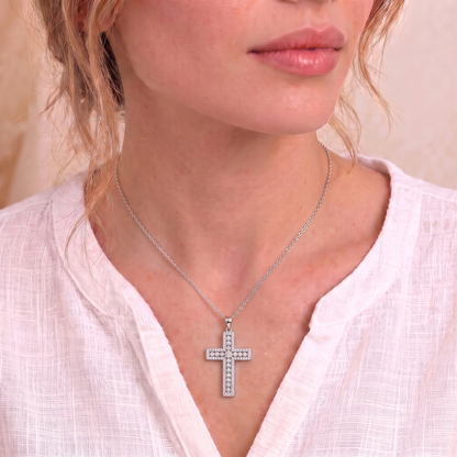 Phoebe moissanite cross necklace on the neck
