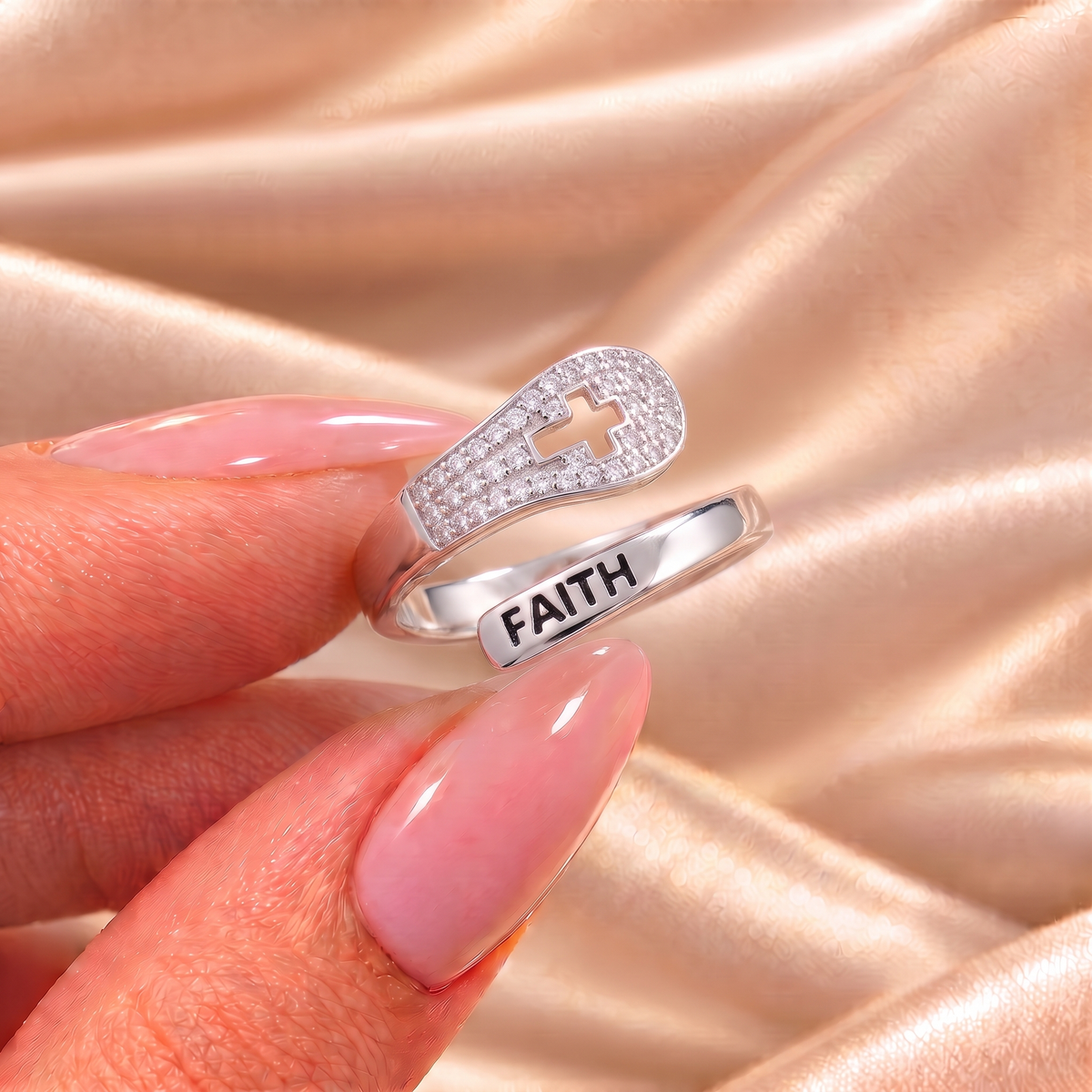 Mary Faith ring held on satin